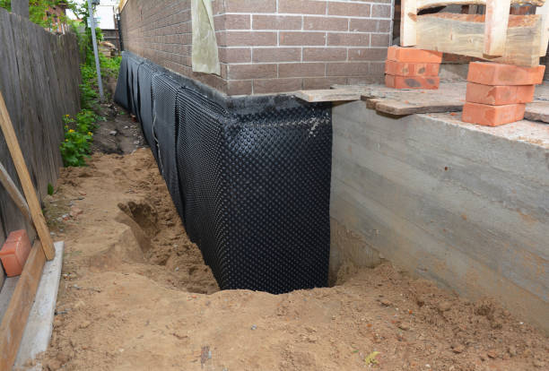 Happy homeowners after waterproofing job in Michigantown